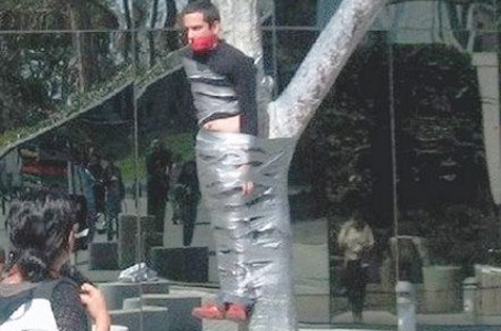 crazy-man-tied-to-tree_01.jpg