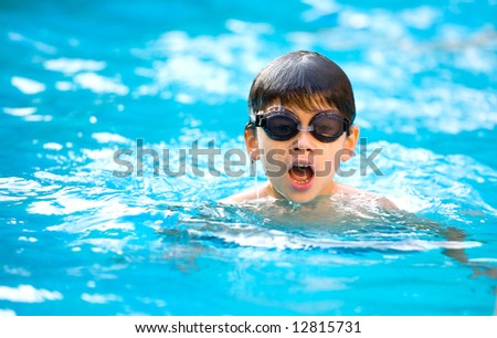 stock-photo-young-boy-enjoying-a-good-swim-in-the-pool-12815731.jpg